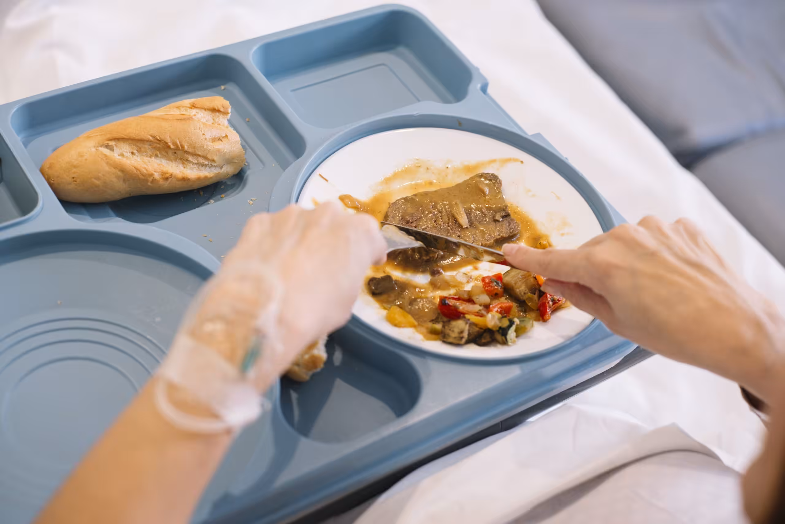 Home - woman eating in the hospital 2025 02 12 04 50 36 utc scaled